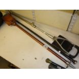 An Edwardian ebony walking cane with unmarked silver top, and two later shooting sticks [C]