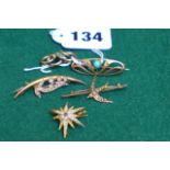 A selection of five 9 ct gold and gem set antique brooches.