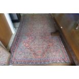 An old Persian rug, pattern throughout with birds and stylised foliage. (Hall) 9ft 6 approx.