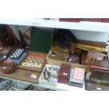 A good collection of wooden wares including chess sets, dominoes, letter racks, coasters, back
