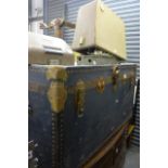 A large vintage metal bound cabin trunk with brass fitments and lock, a Grundig Triumph cased