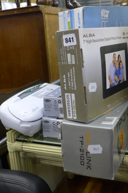 An Alba 7 inch, digital photo frame, boxed, a boxed Bionaire humidifier, two power-surge sockets