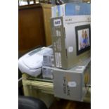 An Alba 7 inch, digital photo frame, boxed, a boxed Bionaire humidifier, two power-surge sockets