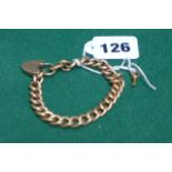 A 15 carat gold curb link bracelet and working padlock with key. Est. Weight 19.2 gms