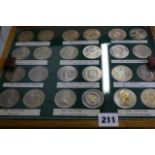 A well presented collection of Twenty-four crowns, each with its face and obverse; 1935 Silver