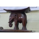 Tribal art African hardwood elephant seat on carved base. (On lot 952 front of room)