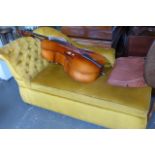 An early 20th century box ottoman covered in buttoned gold velvet.