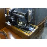 A Singer electric sewing machine No. Y9428467 in carrying case. (On lot 865)