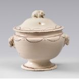 SMALL TUREEN IN CERAMIC, PROBABLY NAPLES, EARLY 19TH CENTURY

cream coloured glazing, motif of pearl