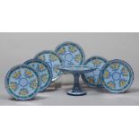 STAND AND SIX PLATES IN CERAMIC, CASTELLINI FAENZA, 20TH CENTURY

glazing in blue, green and