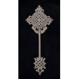 COPTIC-ORTHODOX KEY IN SILVER PLATE, 19TH CENTURY

pierced in geometric and foliate motif. 

Size