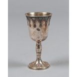 SMALL CUP IN SILVER, 20TH CENTURY

with decorations and bezelled with red stones. 

Size cm. 16 x 7,