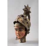 SICILIAN HEAD, 19TH CENTURY

face in wood lacquered in polychrome and helmet in emossed metal.