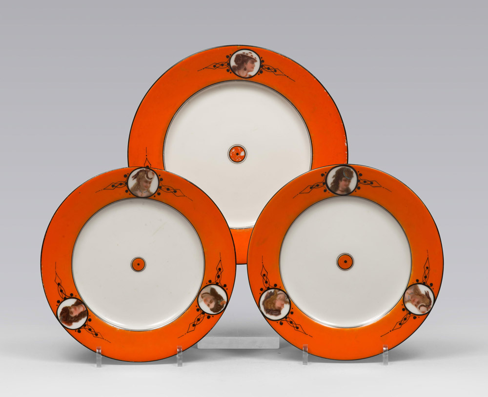 THREE PLATES IN PORCELAIN, PROBABLY SICILIA, LATE 19TH CENTURY

white and orange glazing, with