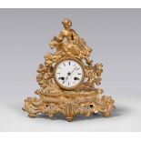GILT METAL CLOCK, 19TH CENTURY

with figure of lady and bird. White enamel clock face. 

Size cm. 33