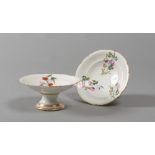 PAIR OF STANDS IN PORCELAIN, 19TH CENTURY

glazing in white and polychrome, with floral motif.

Size