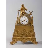 TABLE CLOCK IN ORMOLU, 19TH CENTURY

case as small mountain with figure of hunter. Rectangular base.