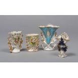FOUR VASES IN PORCELAIN, LATE 19TH CENTURY

glazed in white, polychrome and gold, flowers in relief.