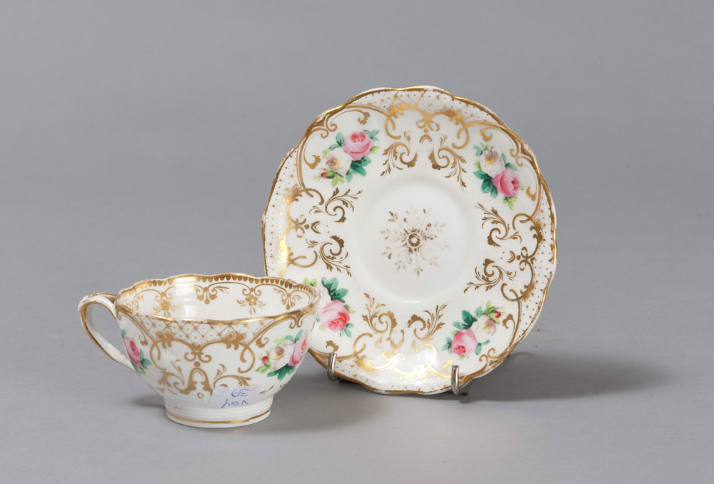 CUP AND SAUCER IN PORCELAIN, 19TH CENTURY

glazed in white, polychrome and gold, with motif of