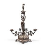 CENTREPIECE IN SILVER PLATE, PROBABLY FRANCE, LIBERTY STYLE

with figure of handmaid and vase in cut