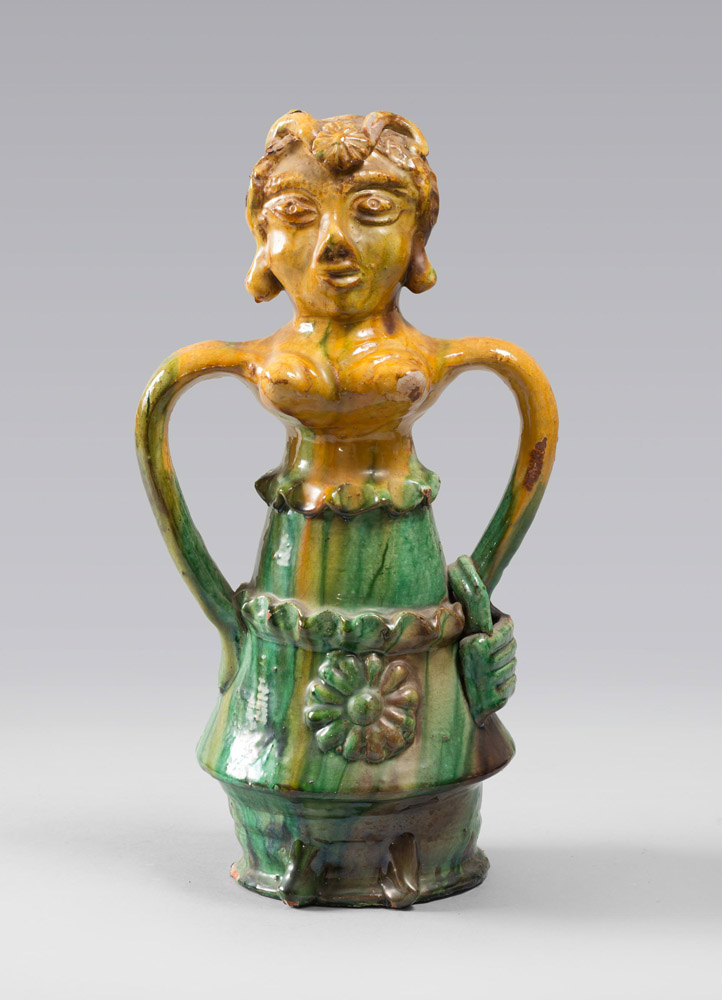 CARAFE IN CERAMIC, SICILIA 19TH CENTURY

glazing in green and ochre, shaped as female figure, with