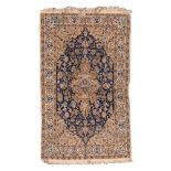 NAIN RUG, MID 20TH CENTURY

ornate foliate design in centre field with blue and cream base. Border