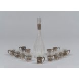 LIQUEUR SET IN SILVER AND GLASS, 20TH CENTURY

one bottle with 13 glass holders, some with