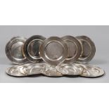 TEN SILVER UNDERPLATES , 20TH CENTURYY
smooth surface and ribbed edge.
Diameter cm. 30. Total