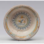 BASIN IN CERAMIC, SOUTHERN ITALY 19TH CENTURY

glazed in white, blue and ochre, painted with bird in