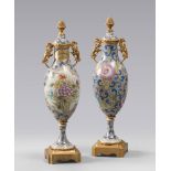PAIR OF VASES IN PORCELAIN, SEVRES 20TH CENTURY

glazing in polychrome, floral decorations and
