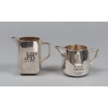 TWO CARAFES FOR WHISKY IN SILVER, 20TH CENTURY

engraved.

Size cm. 15 x 10 x 18 and cm. 13 x 12 x