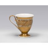 CUP IN PORCELAIN, BERLIN EARLY 20TH CENTURY

glazed in white and gold with motif of ferns and