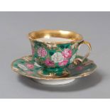 CUP AND SAUCER IN PORCELAIN, 19TH CENTURY

glazed green and polychrome, with motif of roses. Gold
