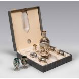 LIQUEUR SET IN SMOKED GLASS, EARLY 20TH CENTURY

damascening in silver with foliate compositions.