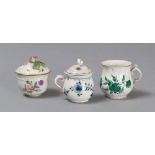 TWO CREAM JUGS AND CUP IN PORCELAIN, 19TH CENTURY

glazed white and polychrome.

Marked Vienna and
