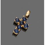 PENDANT

cross shape, in yellow gold 18 kt. with six set cabochon sapphires.

Size cm. 2,5 x 1,8,