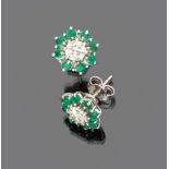 LOVELY PAIR OF EARRINGS

in white gold 18 kt., daisy shaped studded with emeralds and diamonds.