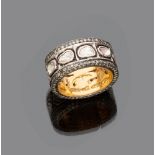 RING

band in gold and silver, studded with rose cut diamonds.

Diamonds ct. 1.00, overall weight