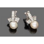 FINE PAIR OF EARRINGS

in white gold 18 kt., with pearls and round cut diamonds.

Pearls mm. 8,5/