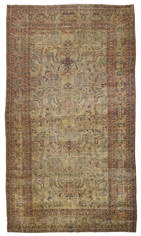 FINE AND RARE KIMAN LAVER RUG, EARLY 20TH CENTURY

design with herati, flowers, palmette and