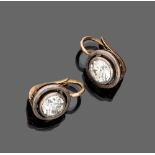 PAIR OF ANTIQUE STYLE EARRINGS

in gold and silver, circular shape with round cut diamonds.