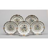 FIVE PLATES IN MAIOLICA, PROBABLY EMILIA, EARLY 19TH CENTURY

white, cobalt and polychrome