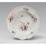 PLATE IN MAIOLICA, PROBABLY EMILIA LATE 18TH CENTURY

floral pattern, in polychrome. 

Diameter