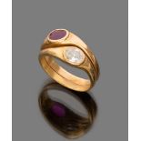 RING 

in yellow gold 18 kt., serpent shaped with set oval cut diamond and one ruby.  

Ruby ct. 0.