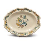 PLATE IN MAIOLICA, NAPLES OR PESARO SECOND HALF 18TH CENTURY

glaze in cream colour, painted with