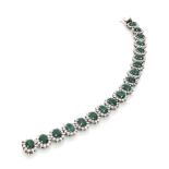 LOVELY BRACELET 

in white gold 18 kt., floral motif with 19 oval cut set emeralds and round cut