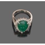 RING

in white gold 18 kt., heart shaped with central emerald and diamond surround. 

Emerald ct.