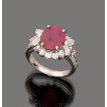 RING

in white gold 18 kt., with central ruby and baguette cut diamond surround. 

Ruby ct. 3.50
