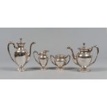 SET IN SILVER, 20TH CENTURY

Empire style, gadrooned borders. Comprising of teapot, coffee pot, milk