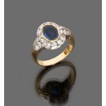 LOVELY RING

in white gold and yellow gold, with oval cut central sapphire and round cut diamond